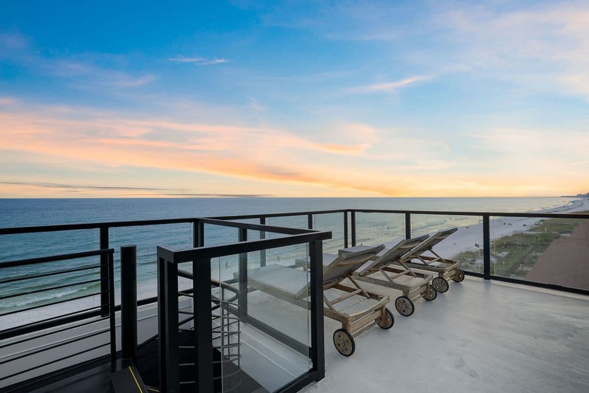 Beach view at sunset from arched terrace